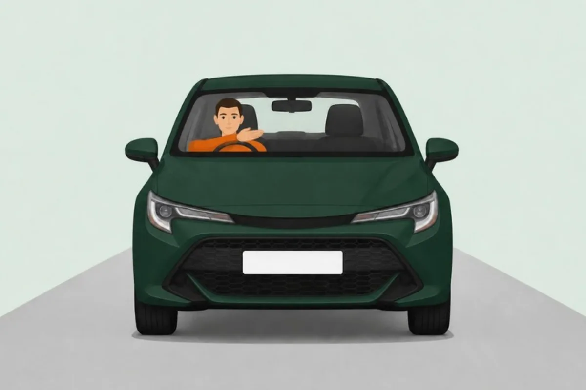 Driver's right arm bent at the elbow, forearm and hand pointing across to the left, seen from the front