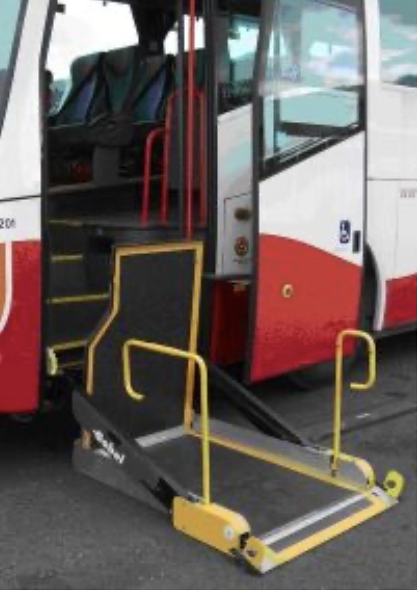 Yellow hydraulic lift platform on coach